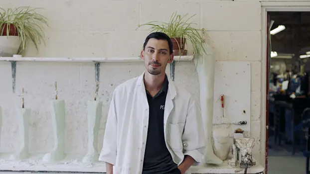 Male orthotics technician engineer stands in workshop