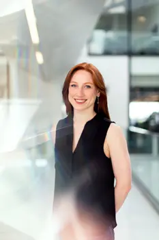 Female software engineer smiles at camera