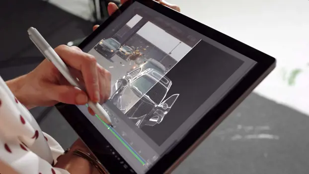 Female software engineer designs special effects on computer tablet