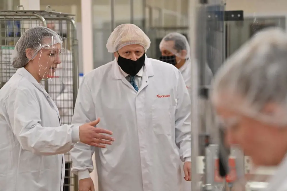 Alice Kan speaking with former UK Prime Minster, Boris Johnson, during a visit to the Wockhardt factory.
