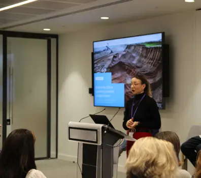 Brogan MacDonald, Head of Sustainability in Building Structures at Ramboll, presenting research at a conference.