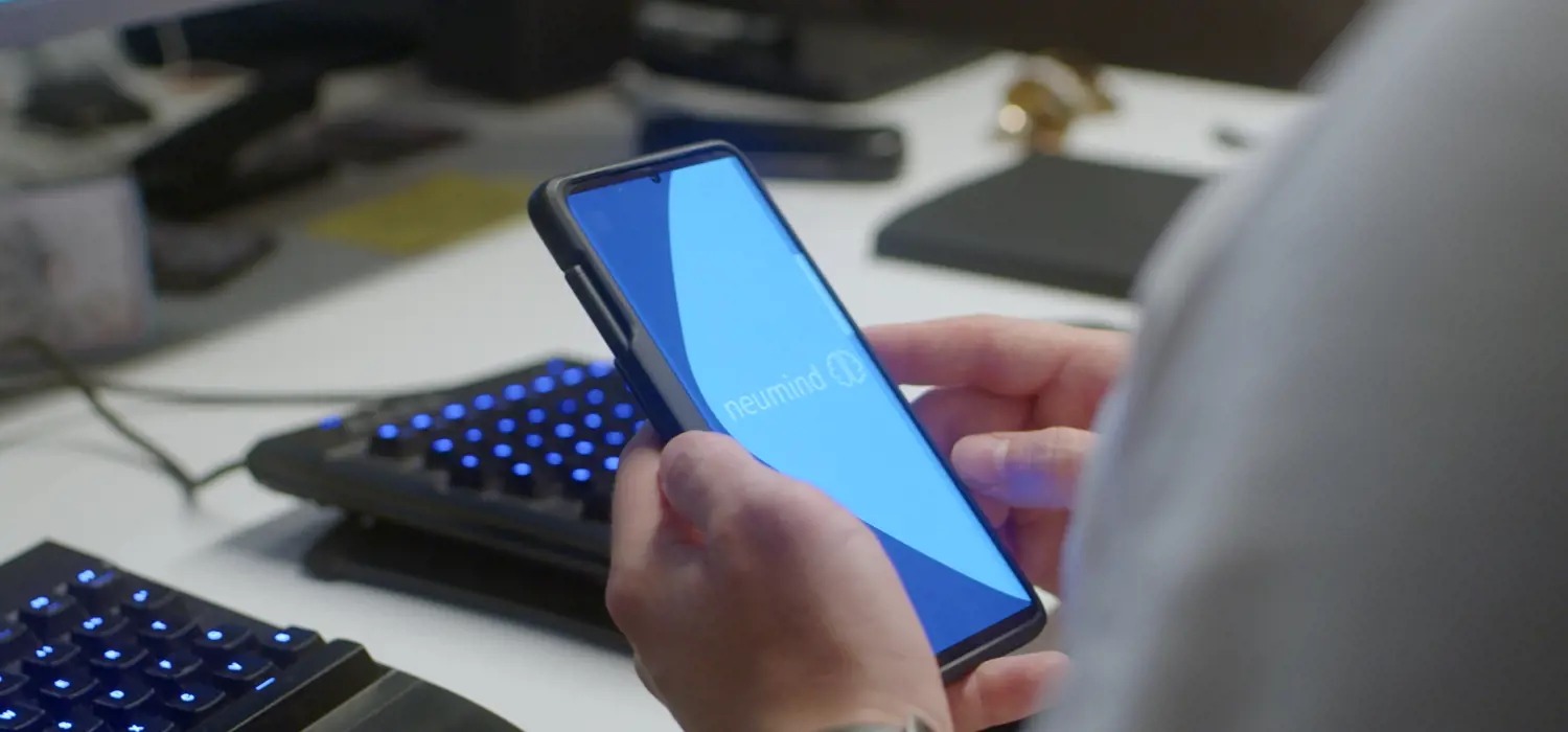 Person looking at a neumind screen on a mobile device