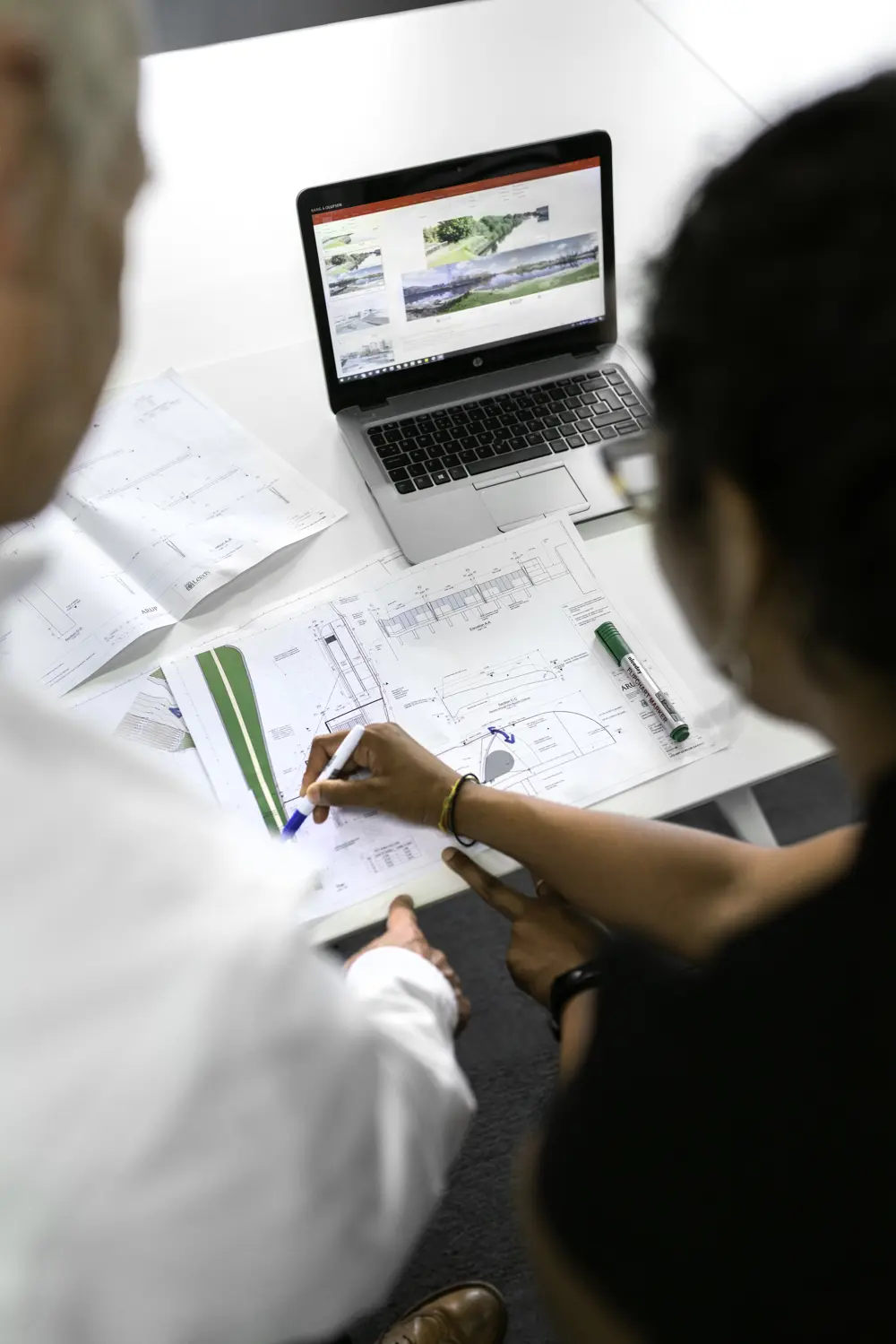 Civil engineers looking at design plans
