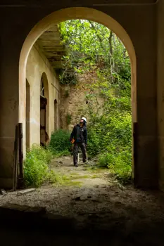 Male structural engineer under building archway